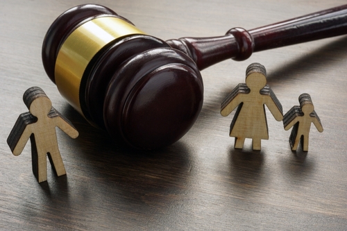 Divorce,And,Alimony,Concept.,Divided,Family,Figurines,And,A,Gavel.